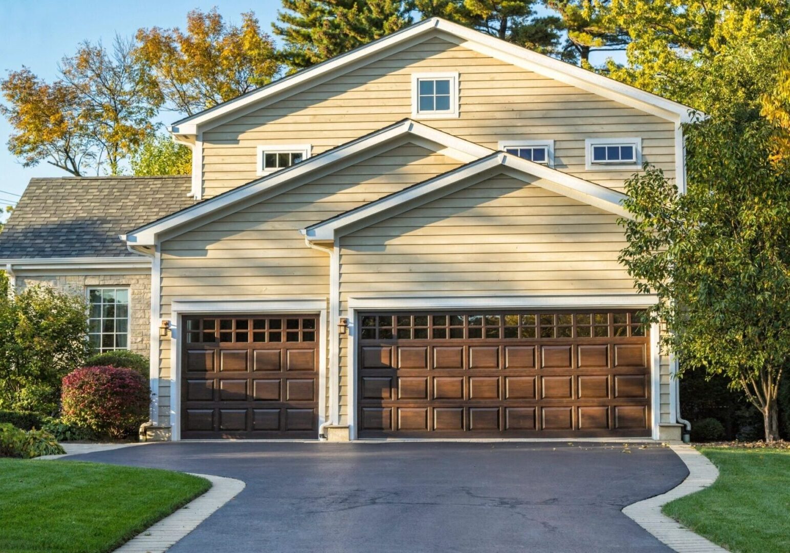 A two car garage with the doors open.
